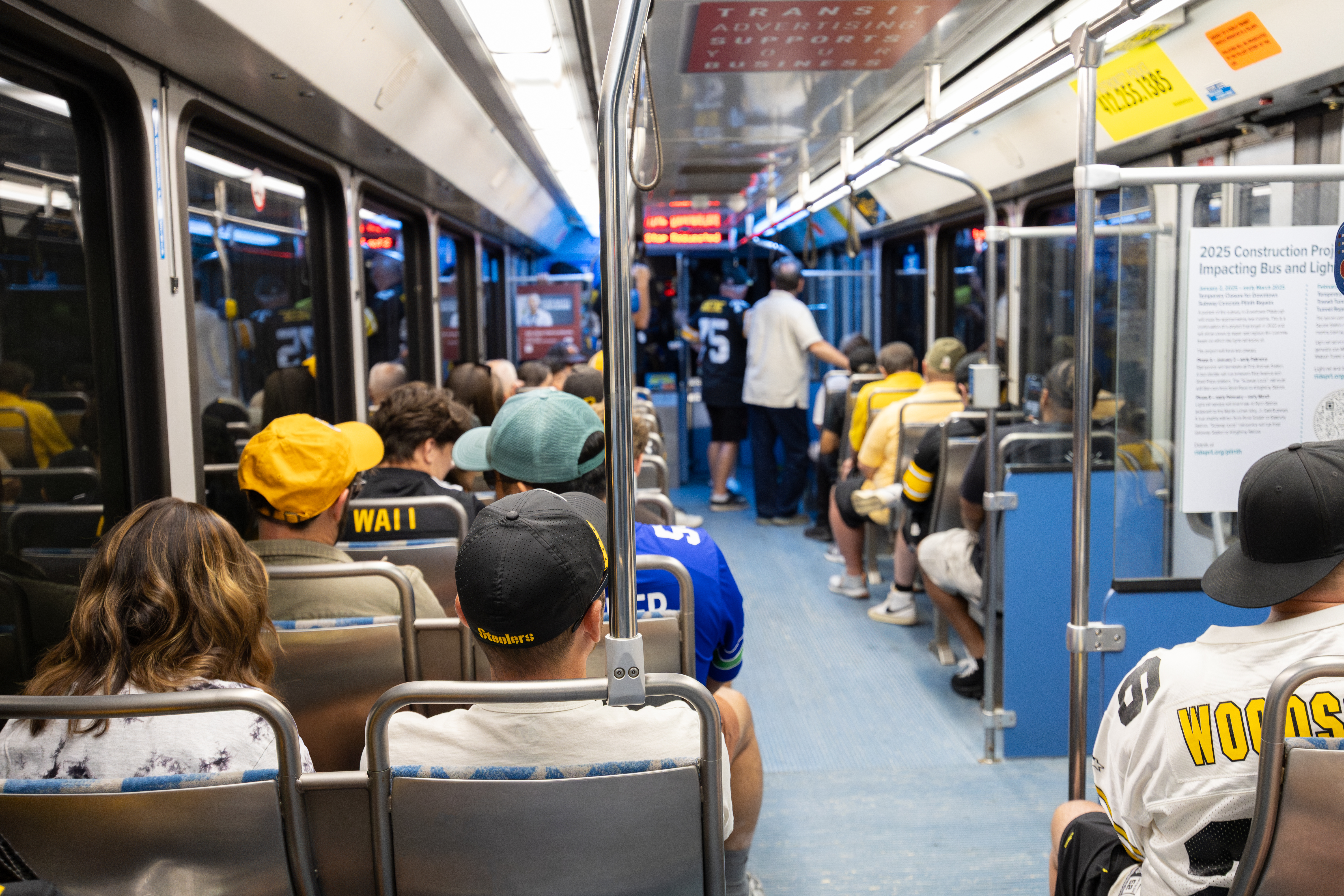 Steelers fans on a light rail car